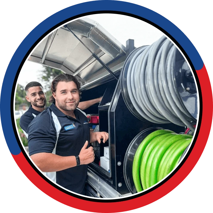 Two of the local drain team at the van between jobs